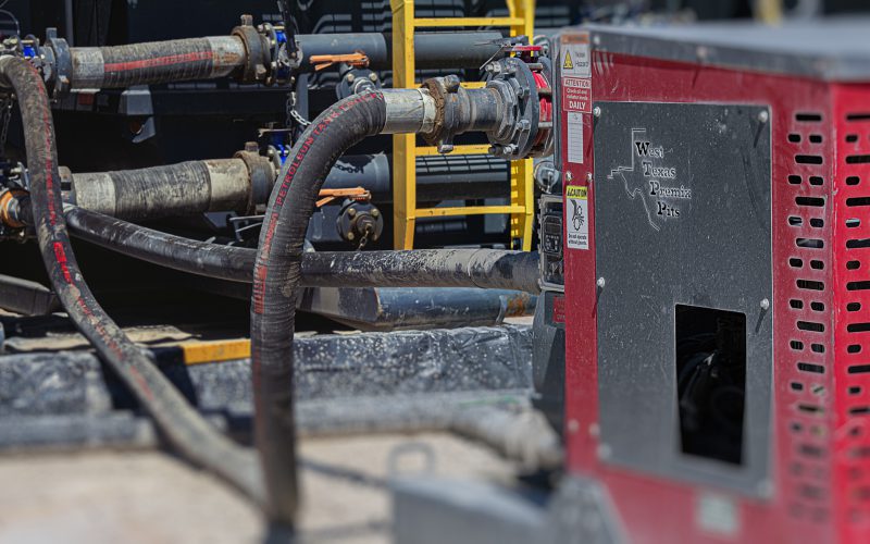 Field hookup of suction and discharge hoses on a Patriot pump unit