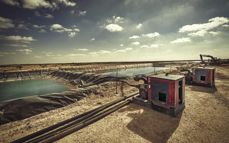 Patriot pump units staged at a lined pit