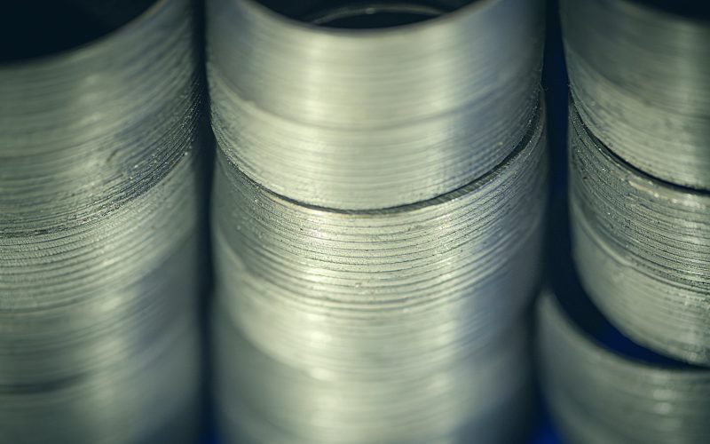 Stack of threaded pipe fittings, close up
